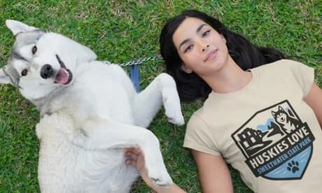 Woman with husky wearing place-based t-shirt example